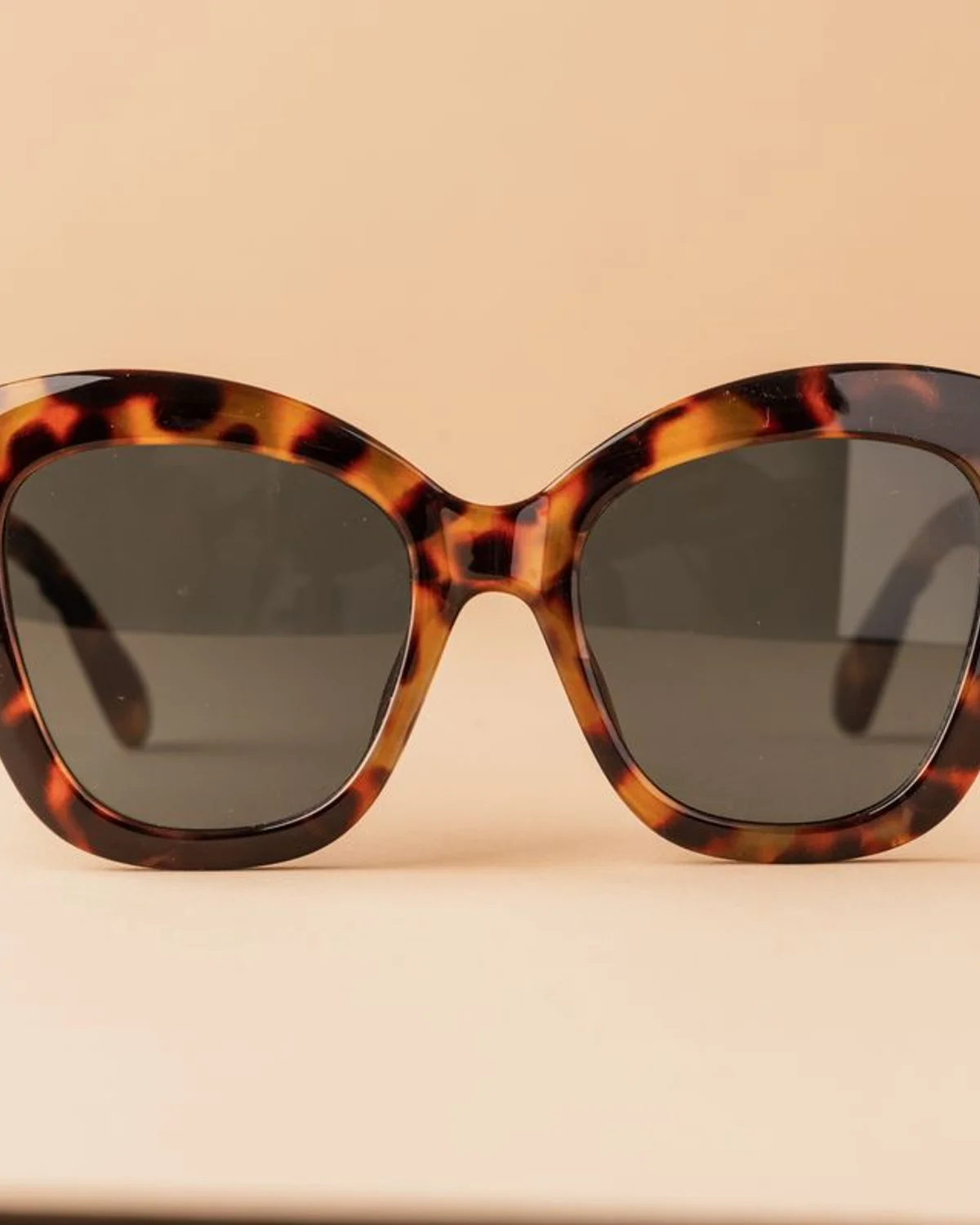 Tortoiseshell eyewear in a warm studio still life